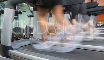 People jogging on a treadmill