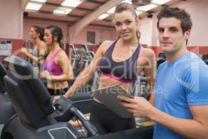 Gym Instructor and woman in the gym