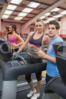 Instructor and woman in the gym