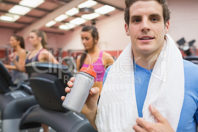 Man drinking in gym