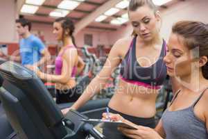 Gym Instructor and woman in the gym