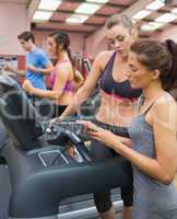 Female Instructor and woman in the gym