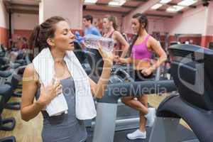 Woman thirsty in gym