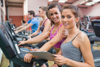 Gym Instructor and woman smiling
