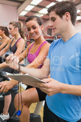 Woman smiling looking at stopwatch