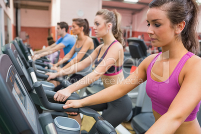 People exercising on exercise bicycles