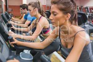 People using exercise bikes