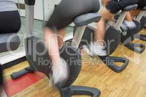 People on exercise bikes