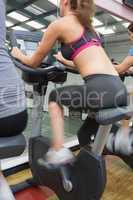 Woman riding on an exercise bike
