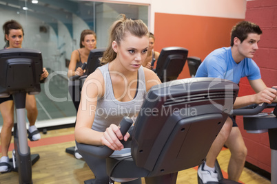 People working out at spinning class