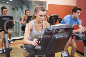 People working out at spinning class