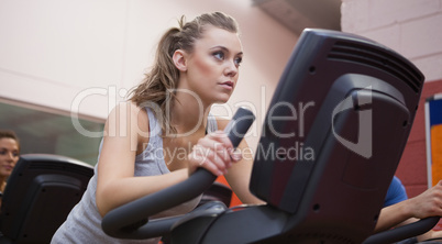 Woman riding in a spinning class