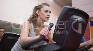 Woman riding in a spinning class