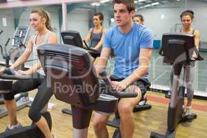 Spinning class riding on a exercise bikes