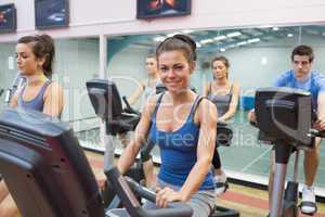 Woman smiling at spinning class