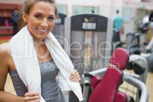 Smiling woman with towel around shoulders