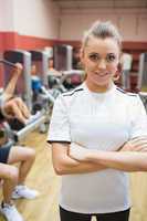 Female trainer in weights room