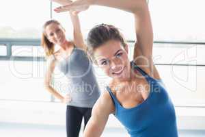 Women stretching their arms