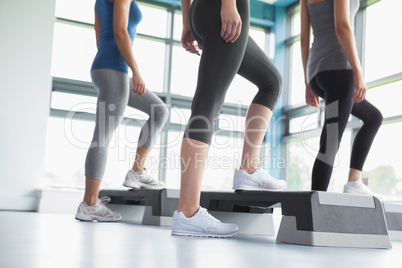 Three women in aerobics class