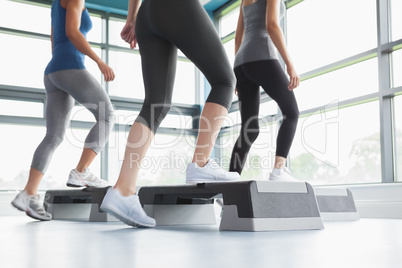 Three women doing aerobics