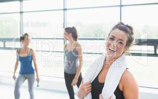 Woman smiling in fitness studio