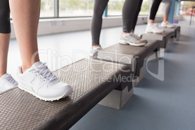 Womens feet stepping in aerobics class