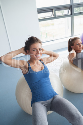 Women training on exercise ball