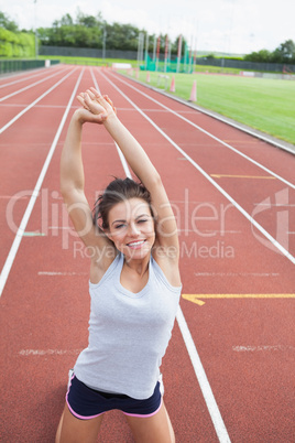Happy woman stretching her arms