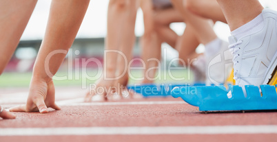 Runners waiting behind the start line