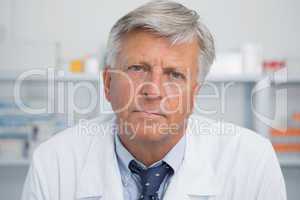 Serious doctor in pharmacy