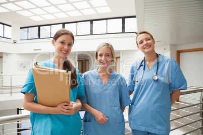 Three nurses in stairwell