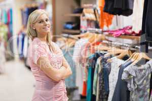 Smiling woman in clothes shop