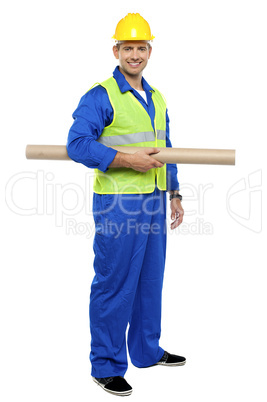 Smiling young architect holding blueprints