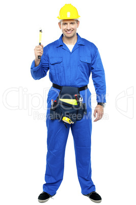 Industrial contractor holding hammer. Full length shot