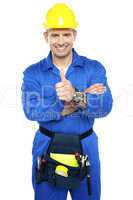 Young industrial contractor showing thumbs up