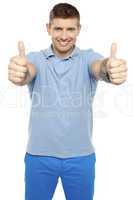 Joyous caucasian male showing double thumbs up
