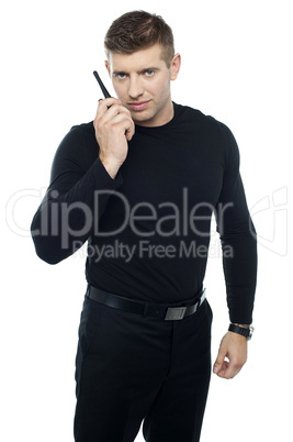 Bouncer guy communicating with his walkie-talkie