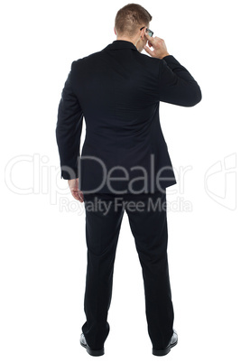 Back pose of young male security person