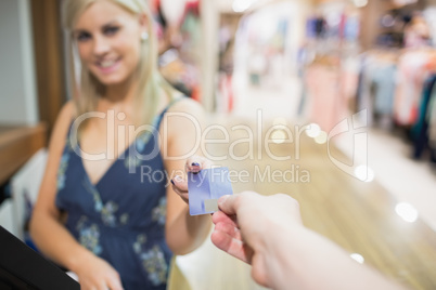 Woman being handed credit card