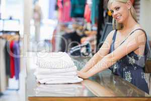 Woman standing behind the counter of the shop