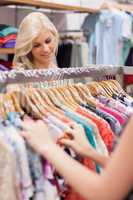 Woman searching at the clothes rack