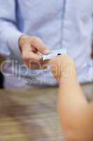 Paying with cash at shop counter