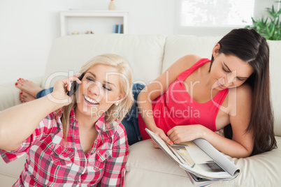 Woman sitting on floor on the phone