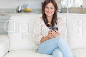 Woman texting and smiling