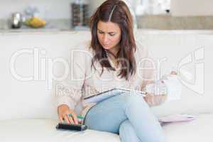 Woman calculating bills