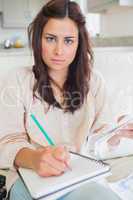 Young woman calculating bills