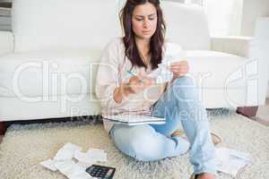 Woman looking at the bills