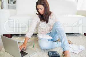Woman calculating on the laptop