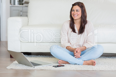 Happy woman with laptop and cellphone