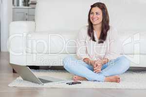 Happy woman with laptop and cellphone